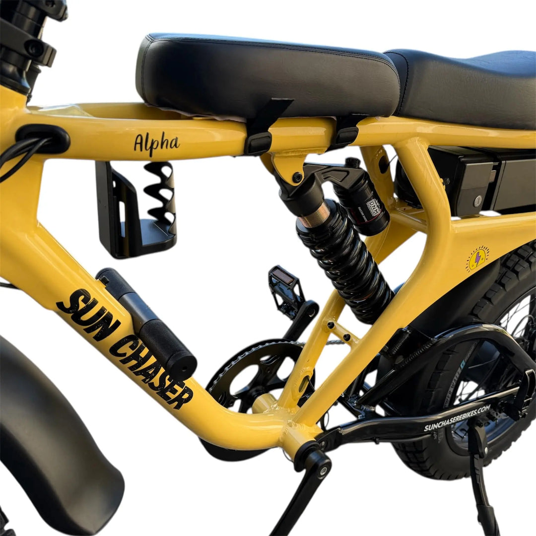 Parent riding eBike with child on front seat with foot pegs