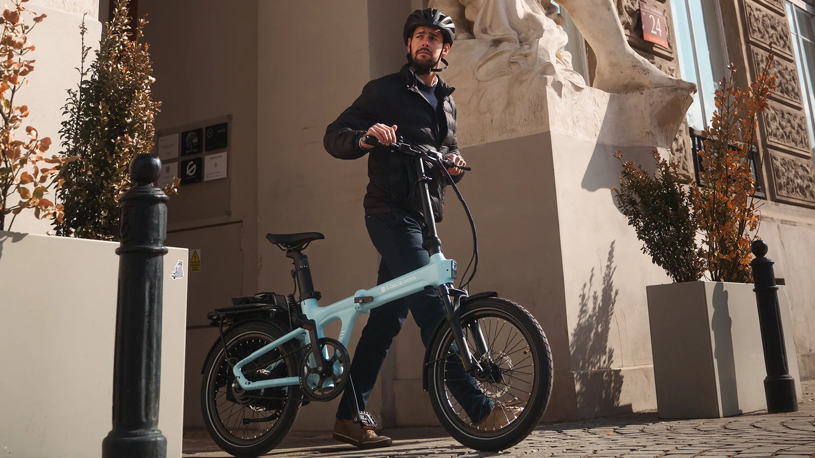 Rider standing with the blue ADO Air 20 Ultra folding e-bike