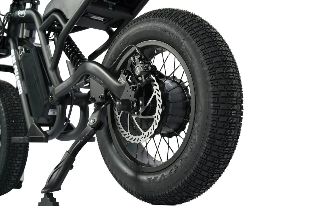 Close-up of a motorcycle wheel with knobby tyres in gold coast